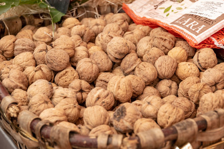 Nice, France - October 5, 2018: View to a basket of walnuts at a market stall.のeditorial素材