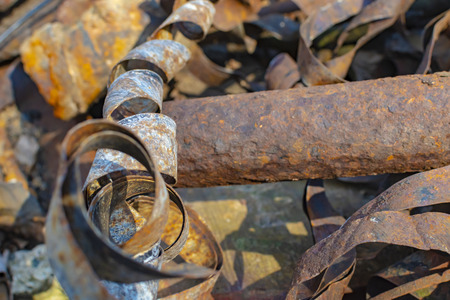 Rusty metal waste lying unsorted in a heap