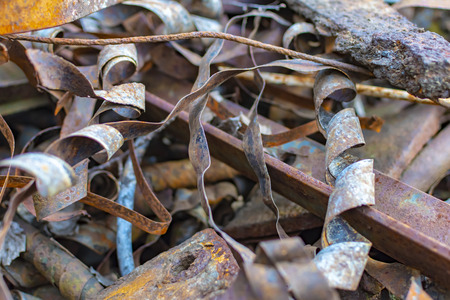 Rusty metal waste lying unsorted in a heapの写真素材