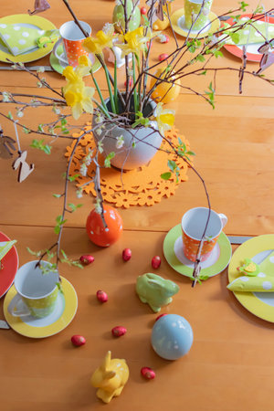 Berlin, Germany - April 1, 2018: View to a View to a colorful easygoing family breakfast table decorated for Easter.のeditorial素材