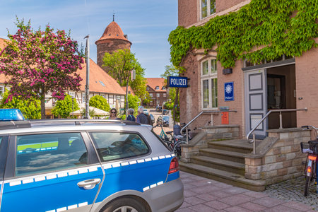 Dannenberg, Germany - May 23, 2019: A German police car parked in front of the police station of a medieval city.のeditorial素材