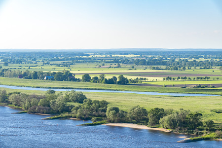 View over the Elbauen in Lower Saxony, Germany. You see a landscape with fields, meadows and the river Elbe.の写真素材