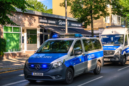 Berlin, Germany - June 28, 2019: Operation of the Berlin police with several emergency vehicles in front of a hookah bar.のeditorial素材