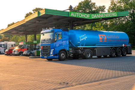 Dannenberg, Germany - May 24, 2019: Tank truck on a busy gas station in Lower Saxony in the light of the setting sun.のeditorial素材