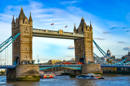 London, Great Britain - August 1, 2015: View to the Tower Bridge over the water with boats on a sunny day with a wonderful blue sky.