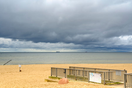 Bansin, Germany - September 13, 2019: Lonely beach on Usedom with view over the sea to dramatic looking storm clouds.のeditorial素材