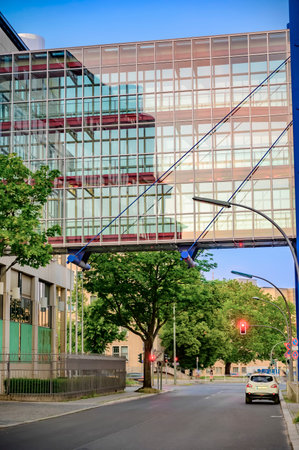 Berlin, Germany - June 28, 2019: Glass transition between two parts of a modern office building in Berlin, Germany.のeditorial素材