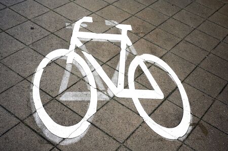 Pictogram painted on paving stones to draw attention to cycler or a bikeway.の写真素材