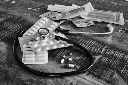 Berlin, Germany - March 2, 2020: Black and white photo of various medical objects, such as stethoscopes and tablets, for the treatment and prevention of diseases.のeditorial素材