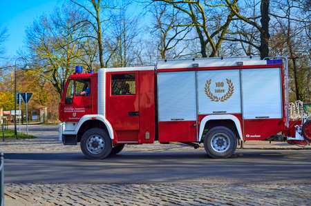 Grossziethen, Germany - April 6, 2020: Fire engine of the volunteer fire brigade on the way to a...