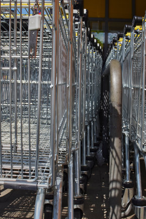 Berlin, Germany - April 2, 2018: View along a row of shopping carts at the height of the shopping carts.のeditorial素材