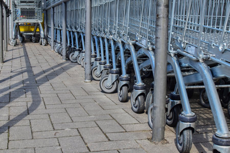 Berlin, Germany - April 2, 2018: View along a row of shopping carts at the height of the shopping carts.のeditorial素材