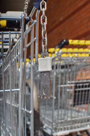 Berlin, Germany - April 2, 2018: View to the deposit lock at a shopping cart that can be solved with a coin.のeditorial素材