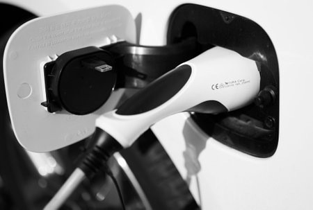Berlin, Germany - March 14, 2020: Black and white photo of the charger of an eco friendly electric...