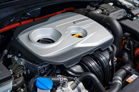 Berlin, Germany - June 24, 2020: A look into the engine compartment of a plug-in hybrid car with...