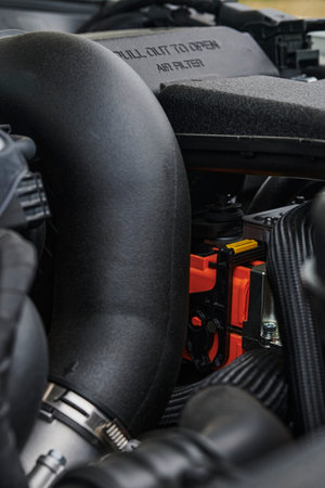 Berlin, Germany - June 24, 2020: A look into the engine compartment of a plug-in hybrid car with...