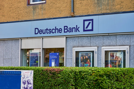 Berlin, Germany - July 14, 2020: Business sign for a bank in a small shopping street in Berlin, Germany.のeditorial素材