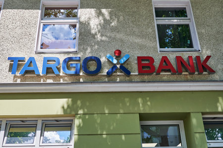 Berlin, Germany - July 14, 2020: Business sign for a bank in a small shopping street in Berlin, Germany.のeditorial素材