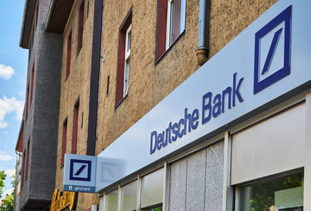 Berlin, Germany - July 14, 2020: Business sign for a bank in a small shopping street in Berlin, Germany.のeditorial素材