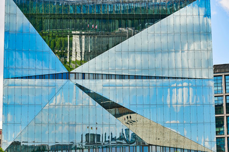 Berlin, Germany - June 14, 2020: A glass facade reflecting the Berlin Reichstag and the Swiss embassy in the government district of Berlin, Germany.のeditorial素材