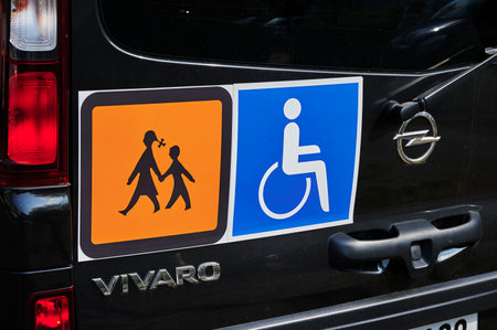 Berlin, Germany - September 12, 2020: Signs on a school bus for handicapped children.のeditorial素材