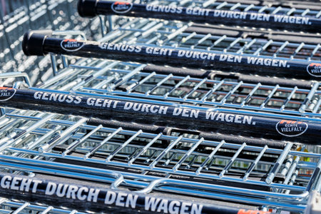 Berlin, Germany - October 3, 2020: View to a row of shopping carts in front of a shop.のeditorial素材