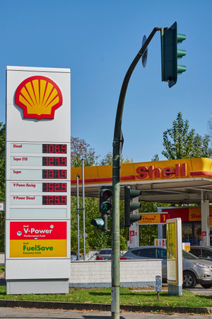 Berlin, Germany - September 17, 2020: View to a Shell Group petrol station with price board and building.のeditorial素材