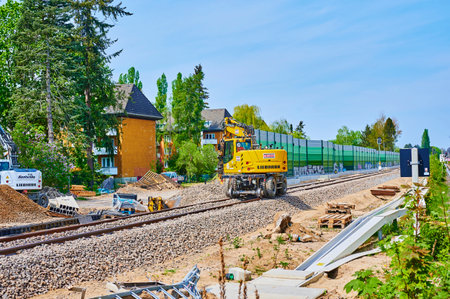 Berlin, Germany - April 28, 2020: Excavator at a construction site on a railway line in South Berlin.のeditorial素材