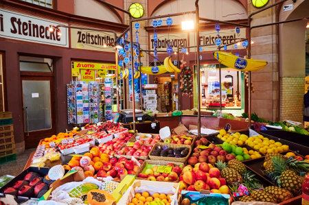 Berlin, Germany - May 13, 2020: A market stall with various colorful varieties of fruits and other...