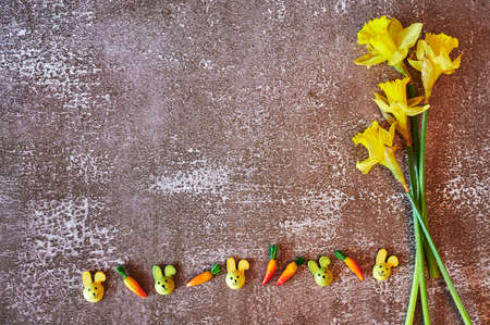 Some yellow jonquils with traditional Easter decoration.
