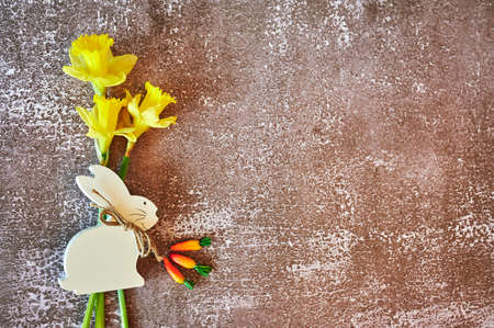 Some yellow jonquils with traditional Easter decoration.