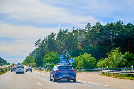 Freeway 11, Germany - September 15, 2019: Car with a bike carrier attached on the top and a bicycle...