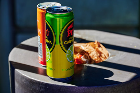 Schoenefeld, Germany - September 3, 2021: Two empty beverage cans that have been placed on a full trash can.のeditorial素材