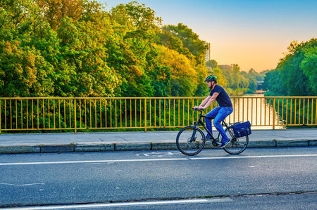 Berlin, Germany - September 10, 2021: Street scene with cyclist in Berlin. The cycle path was painted to give cyclists more space in traffic.のeditorial素材