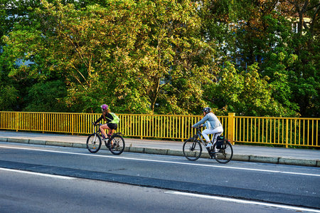 Berlin, Germany - September 10, 2021: Street scene with cyclists in Berlin. The cycle path was painted to give cyclists more space in traffic.のeditorial素材