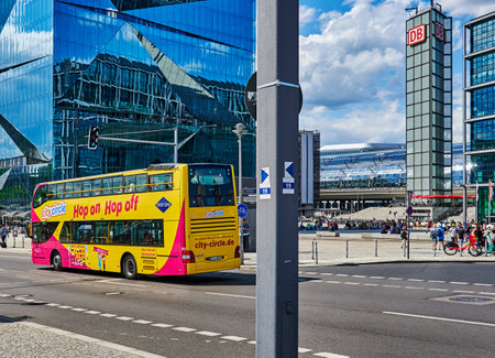 Berlin, Germany - July 29, 2021: Hop on hop off bus near the Hauptbahnhof in downtown Berlin. At the left side you can see the Cube Berlin.のeditorial素材
