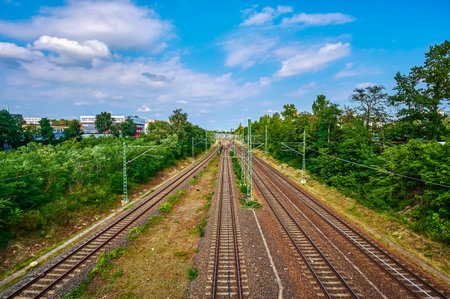 Berlin, Germany - September 5, 2021: View to railway tracks of the Deutsche Bahn with catenaries, which belong to the main connection from north to south through Berlin.のeditorial素材