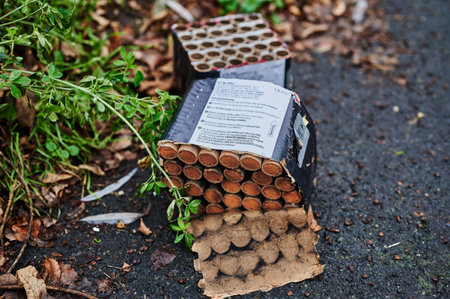 Berlin, Germany - January 1, 2022: Various remains of a New Year's Eve celebration on the sidewalk...