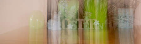 Banner with different Easter decorations created by a blur effect. The text on the sign is German for Easter.の写真素材