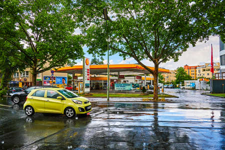 Berlin, Germany - May 25, 2022: View to a Shell Group petrol station at rainy weather.のeditorial素材