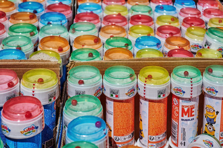 Berlin, Germany - June 22, 2022: Sales stand with various colorful containers for soap bubbles.のeditorial素材