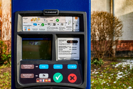 Berlin, Germany - February 9, 2023: Parking ticket machine to pay for a temporary parking space.のeditorial素材