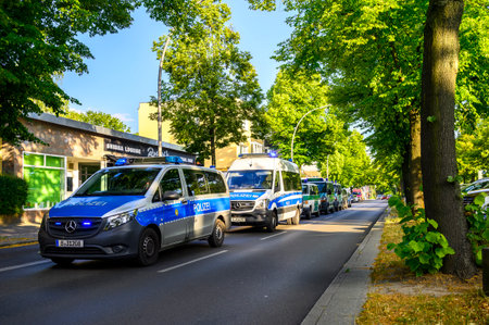 Berlin, Germany - June 28, 2019: Operation of the Berlin police with several emergency vehicles in front of a hookah bar.のeditorial素材