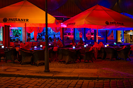 Berlin, Germany - August 3, 2019: Night shot of a colorfully illuminated restaurant in downtown Berlin.のeditorial素材