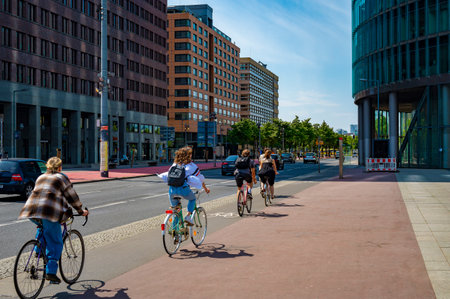 Berlin, Germany - May 8, 2020: Cyclists on a bike path at Potsdamer Platz in downtown Berlin.