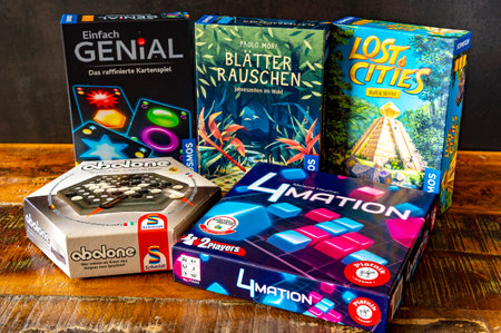 Berlin, Germany - March 13, 2023: Different board games on a wooden table.