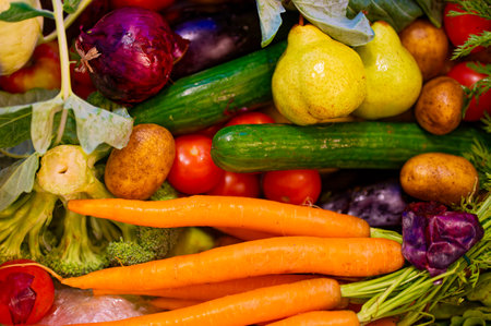 Various fresh ingredients for cooking such as potato, carrot, tomato and cucumber.の写真素材