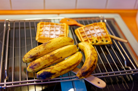 Ready-made waffles that lie on a grating to cool and bananas as an ingredient.の写真素材