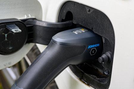 Berlin, Germany - October 10, 2023: View to the charger of an eco friendly electric car.のeditorial素材