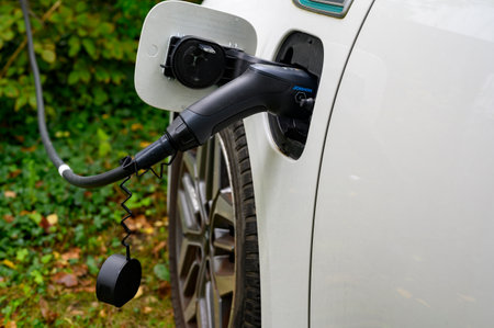 Berlin, Germany - October 10, 2023: View to the charger of an eco friendly electric car.のeditorial素材